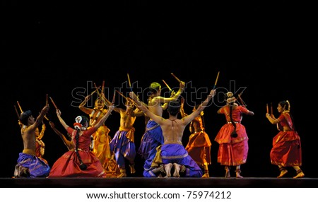 CHENGDU - OCT 24: Indian dancers perform folk dance onstage at JINCHENG theater during the festival of India in china on Oct 24, 2010 in Chengdu, China.