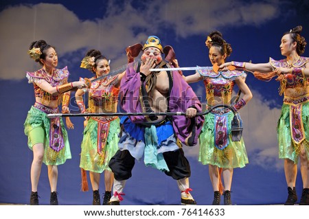 CHENGDU - JULY 23: Chinese opera actors perform traditional drama onstage at Arts Academy theater of Sichuan Jul 23, 2010 in Chengdu, China.