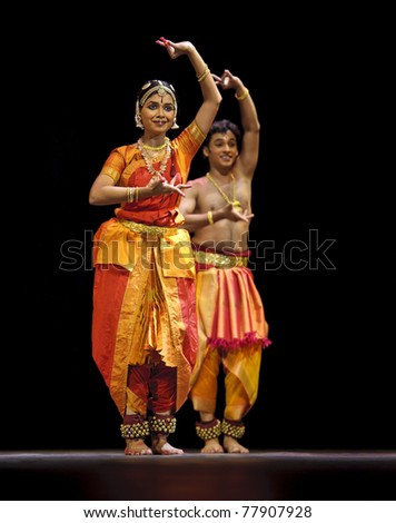 CHENGDU, CHINA - OCT 24: Indian dancers perform folk dance onstage at JINCHENG theater during the festival of India in China on Oct. 24, 2010 in Chengdu, China.
