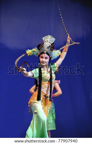 CHENGDU, CHINA  - JULY 23: Chinese opera actress performs traditional drama onstage at Arts Academy theater of Sichuan on July 23, 2010 in Chengdu, China.