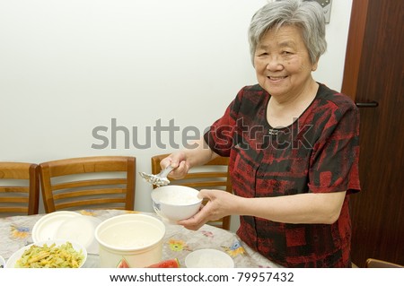 The grandmother is preparing dinner