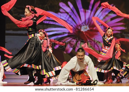 CHENGDU - SEP 28: chinese Tibetan ethnic dancers perform on stage at JIAOZI theater.Sep 28,2010 in Chengdu, China.