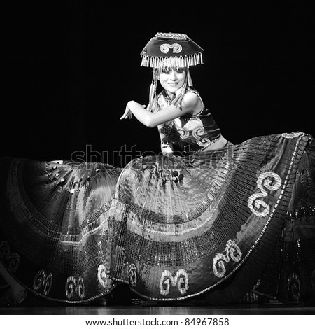 CHENGDU - SEP 26: chinese Yi ethnic dancer performs on stage at JIAOZI theater.Sep 26,2010 in Chengdu, China.