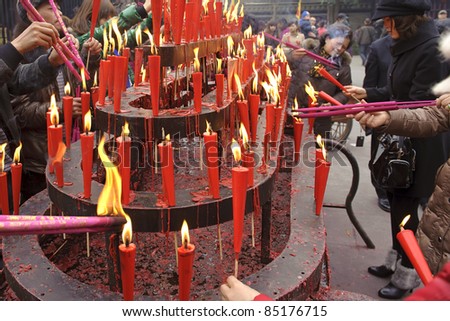 CHENGDU, CHINA - FEB 5: People burning incense upon the incense altar in temple during Chinese New Year on Feb 5, 2011 in Chengdu, China .People want to relieve worries and difficulties by burning incense.