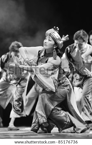 CHENGDU, CHINA - SEPT 28: Chinese Qiang ethnic dancers perform on stage at Sichuan experimental theater on Sept 28, 2010 in Chengdu, China.