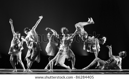CHENGDU - DEC 15: chinese dancers perform folk dance on stage at JINCHENG theater.Dec 15,2007 in Chengdu, China. Choreographer: Hou Bo, actor: Yang Xiaofan, Yang Yang, Zhong Shan