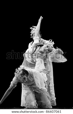 CHENGDU, CHINA - DEC 13: Chinese dancers perform modern Trio dance on stage at JINCHENG theater in the 7th national dance competition of China on Dec 13, 2007 in Chengdu, China.