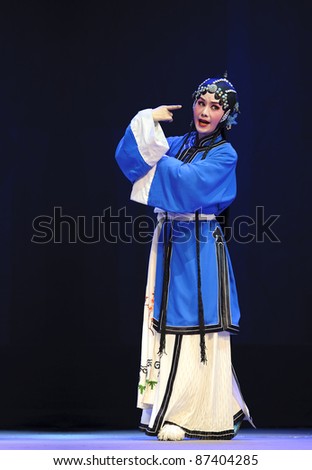CHENGDU - JUN 8: Chinese Chu opera performer make a show on stage to compete for awards in 25th Chinese Drama Plum Blossom Award competition at Experimental theater.Jun 8, 2011 in Chengdu, China.