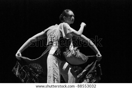CHENGDU - DEC 11: chinese modern dancers perform duo dance on stage at JINCHENG theater in the 7th national dance competition of china on Dec 11,2007 in Chengdu, China.