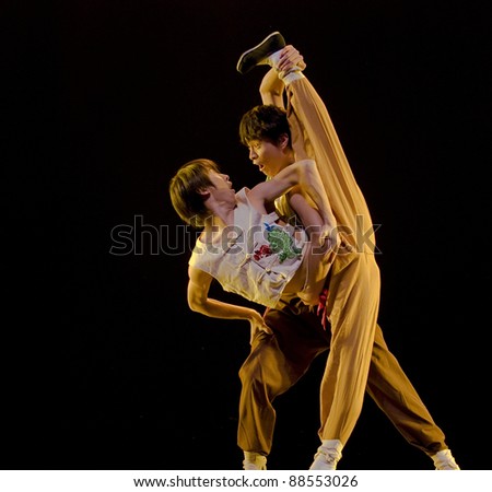 CHENGDU - DEC 12: modern dancers perform duo dance on stage at JINCHENG theater in the 7th national dance competition of china on Dec 12,2007 in Chengdu, China.
