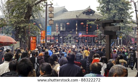 CHENGDU - FEB 14: crowded People waiting to enter a temple to pray to Buddha during chinese new year on Feb 14, 2010 in Chengdu, China. It\'s part of the important traditional custom in China.