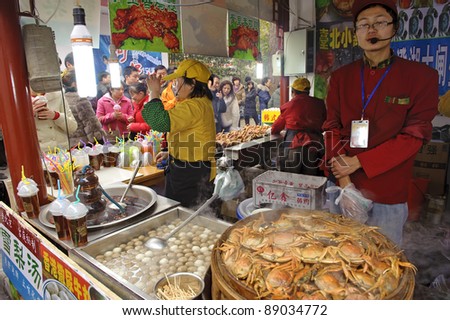 CHENGDU - FEB 7: Salesman selling food in snack bar in a park during chinese new year on Feb 7, 2011 in Chengdu, China.