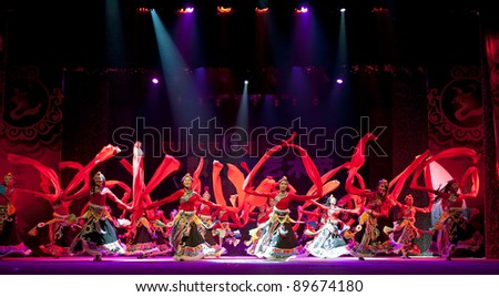 CHENGDU - SEP 28: Chinese Tibetan ethnic dancers perform on stage in the 6th Sichuan minority nationality culture festival at JINJIANG theater.Sep 28,2010 in Chengdu, China.