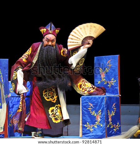 CHENGDU - JUN 6: Mulian Drama of Chinese Qi opera performer make a show on stage at Experimental theater.Jun 6, 2011 in Chengdu, China.