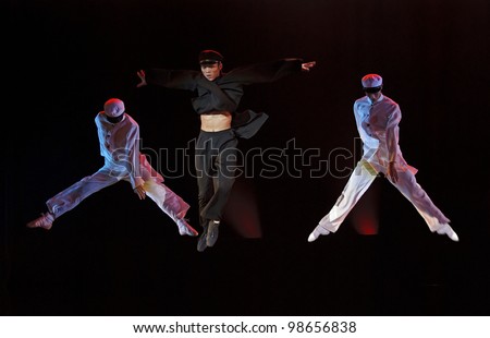 CHENGDU, CHINA - DEC 10: Unidentified modern dancers perform group dance on stage at Jincheng theater in the 7th national dance competition of China on Dec 10, 2007 in Chengdu, China.