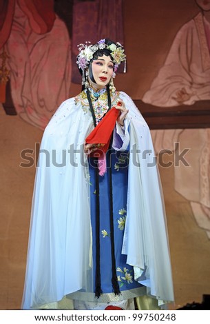 CHENGDU, CHINA - JUNE 3: chinese Cantonese opera performer make a show on stage to compete for awards in 25th Chinese Drama Plum Blossom Award competition at Jinsha theate on June 3, 2011 in Chengdu, China.