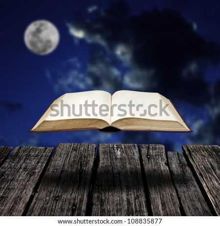 Mystery flying book with night sky, Education inspiration concept