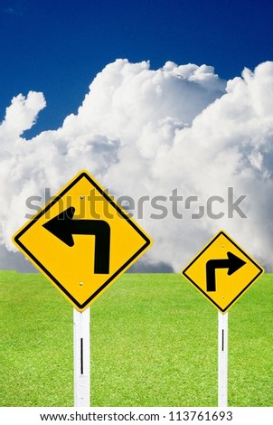 Turn right and turn left sign with nice landscape