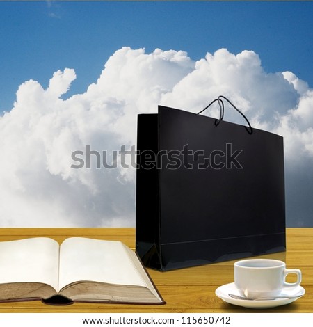 Nice glossy shopping bag with blank book and coffee cup