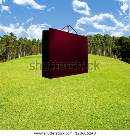 Shopping travel package concept, Shopping bag on nice golf couse landscape