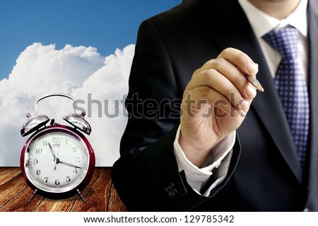 Businessman sign contract with time limit concept