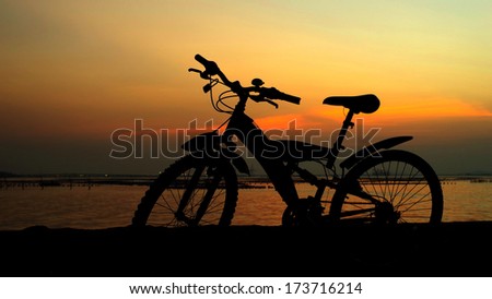 Mountain bike silhouette with sunset sky, Thailand