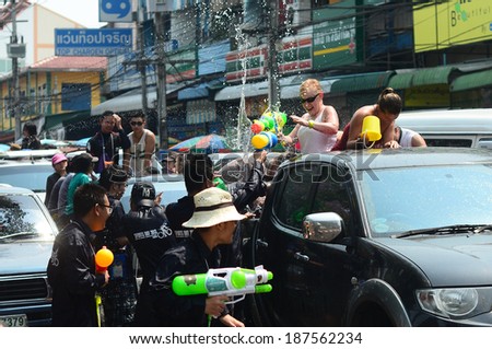 CHIANG MAI, THAILAND - APRIL 13 : Foreigners and Thai people enjoy splashing water together in songkran festival on 13 April 2014 in Chiang Mai, Thailand