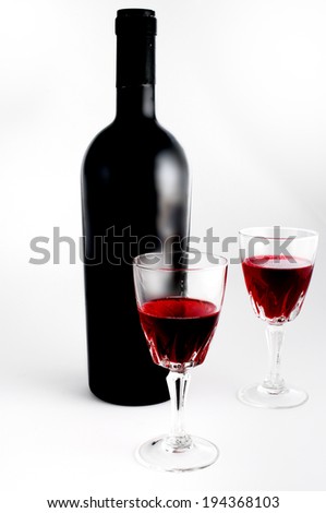 Wine glass and wine bottle still life isolated on white background