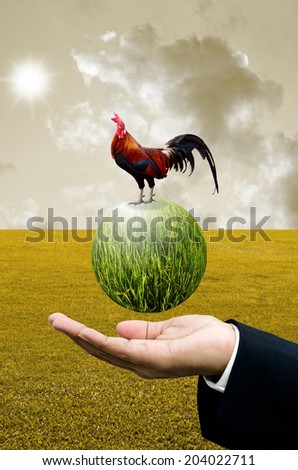 Businessman show the green planet with chicken, Organic farm concept