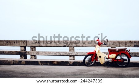 CHONBURI- NOVEMBER 19 : Retro motorcycle on bridge  on November 19, 2013 in Sriracha, Chonburi, Thailand.