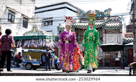 SRIRACHA, THAILAND -  FEBRUARY 5 : Chinese opera actors walking across the street to offering Shrine of the Black Sea on February 5, 2015 in  Sriracha, Chonburi, Thailand