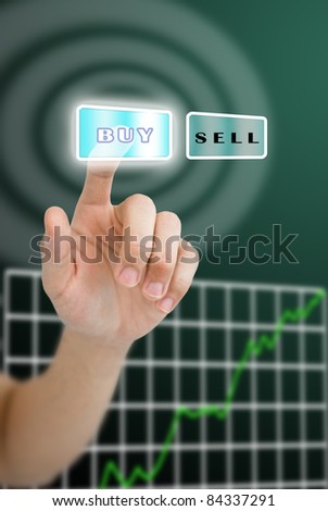 Hand pushing buy button with grown up stock market graph