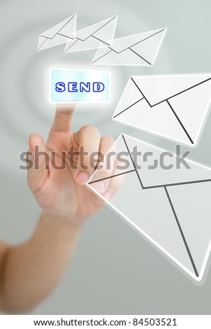 Hand pushing the send button for send the mail, Email concept