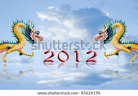 Two dragon statue flying with 2012 number on reflected ground, New year greeting card background