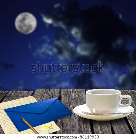 Hot coffee and letter paper for write mail with night sky