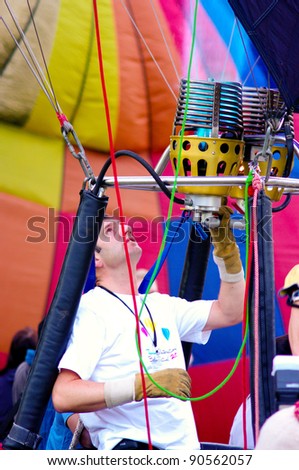 CHIANG MAI, THAILAND - NOV 25 : Unidentified man to prepare the faucet gas of balloon on Nov 25, 2011 at Prince Royal\'s College in Chiang Mai, Thailand International Balloon Festival 2011