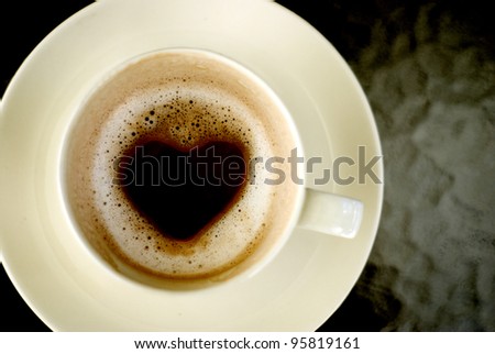 Heart shape inside hot coffee cup, Love concept