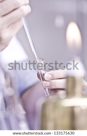 Experiment with a test tube in a laboratory Experiment with a test tube in a laboratory