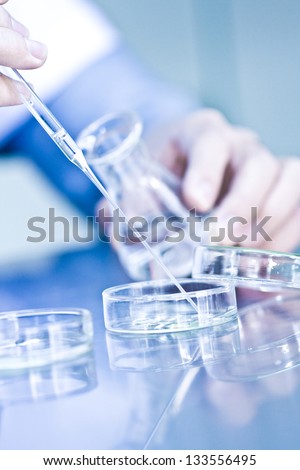 Doctor With Test Tube In A Laboratory Experiment