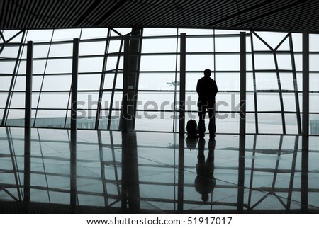 Airport windows, people on the back