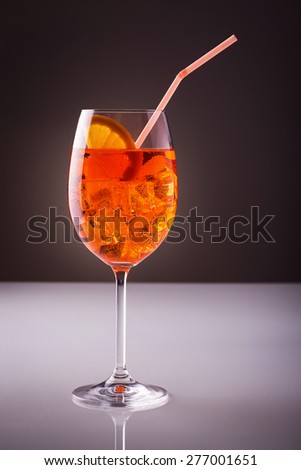 Long drink; alcoholic light drink wine-based with straw and orange slice