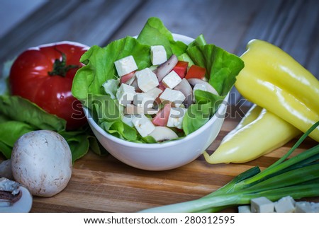 Fresh vegetable salad with cottage, mushrooms, tomatoes and onion