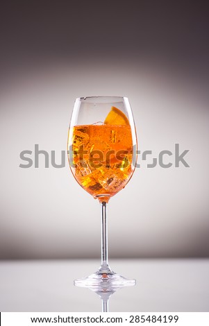 Long drink; aperitif with sparkling wine, orange slice and soda