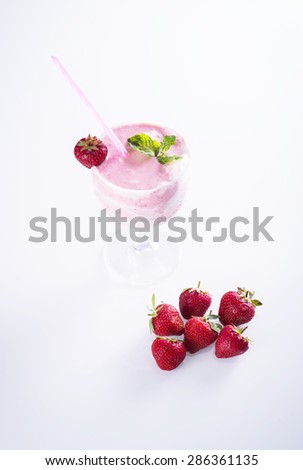 Strawberry smoothie with fresh strawberries, yogurt and mint leaf