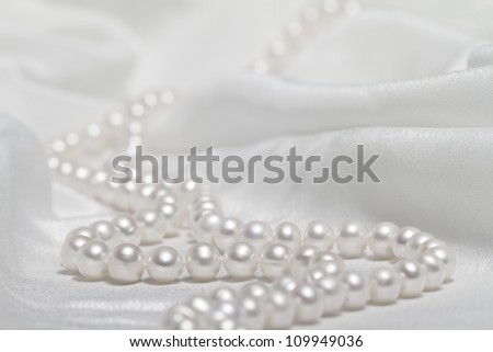 Pearl necklace and silk