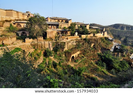 SHANXI,CHINA - OCT 4: Lijiashan, a 550-year-old cave village, hugging a hillside set back from the Yellow River, is typical on OCT 4,2013 in China.