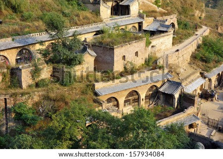 SHANXI,CHINA - OCT 4: Lijiashan, a 550-year-old cave village, hugging a hillside set back from the Yellow River, is typical on OCT 4,2013 in China.