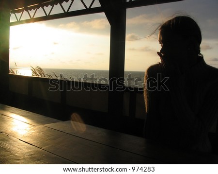 The woman and sunset, silhouette at sunset