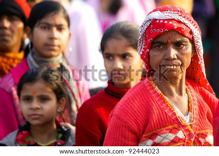 NEW DELHI, INDIA – JAN. 23: Unidentified Indian woman waits to enter the Lotus Temple with daughters on January 23, 2011 in New Delhi. The Lotus Temple is the mother temple of the Indian sub continent