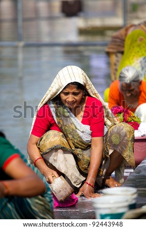 UDAIPUR, INDIA - JANUARY 25: Unidentified Indian woman washing clothes